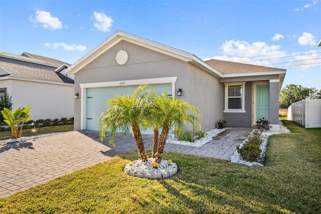 11829 Brighton Knoll Loop, Riverview, FL 33579 - ranch-style home featuring a garage, stucco siding, and decorative driveway