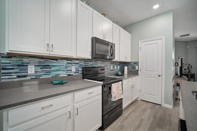 11829 Brighton Knoll Loop, Riverview, FL 33579 - kitchen featuring black appliances, light wood-style floors, white cabinets, backsplash, and recessed lighting