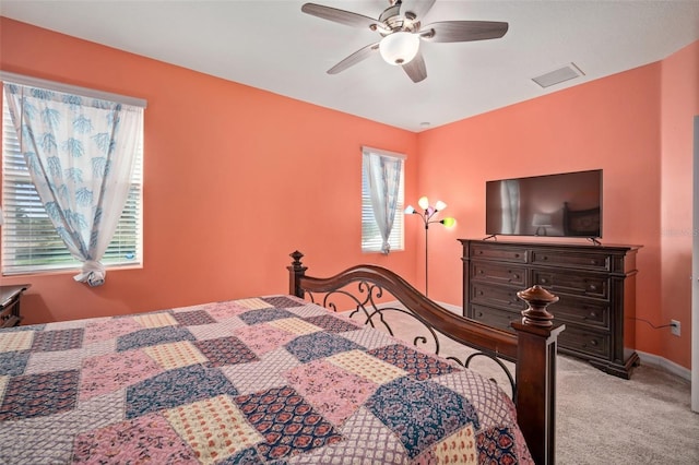 11829 Brighton Knoll Loop, Riverview, FL 33579 - bedroom with multiple windows, light carpet, and ceiling fan