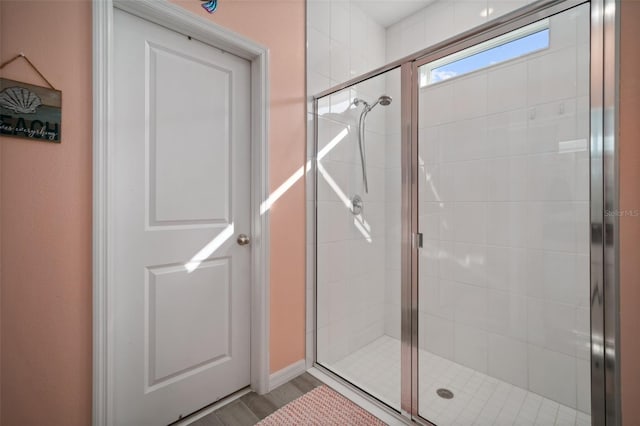 11829 Brighton Knoll Loop, Riverview, FL 33579 - bathroom with a stall shower and wood finished floors