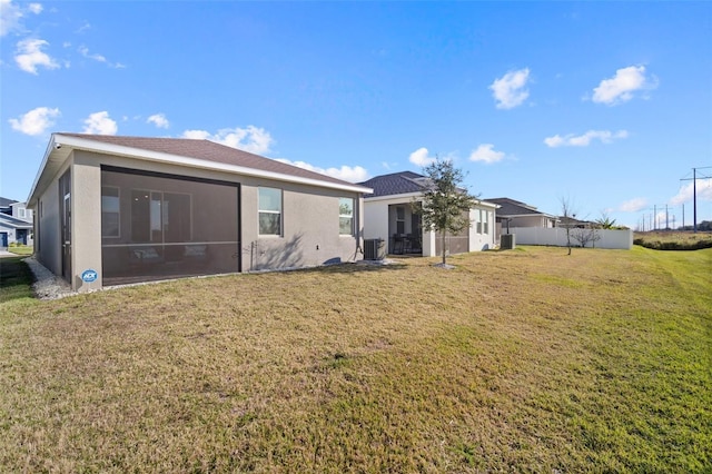 11829 Brighton Knoll Loop, Riverview, FL 33579 - back of property featuring a lawn, stucco siding, and a sunroom