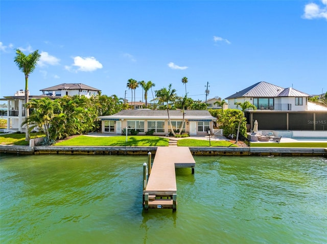 11085 9th St E, Treasure Island, FL 33706 - dock area with a water view and a patio