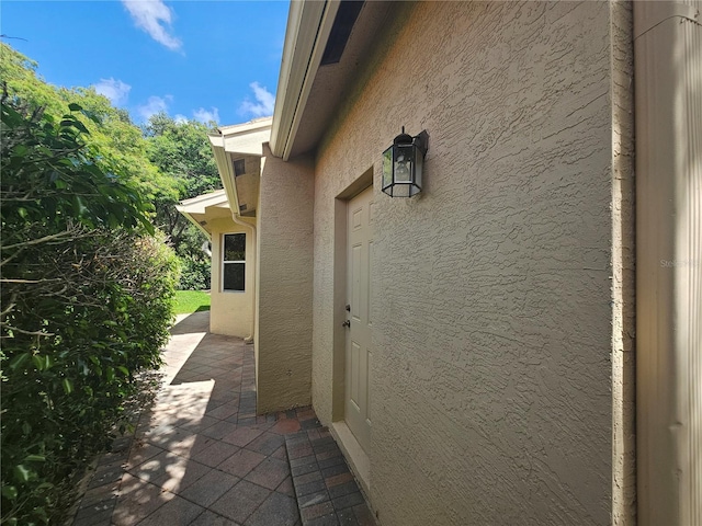 6900 Molakai Cir, Boynton Beach, FL 33437 - entrance to property featuring stucco siding and a patio
