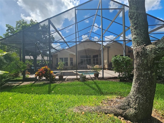 6900 Molakai Cir, Boynton Beach, FL 33437 - back of property with a lanai, stucco siding, a yard, and an outdoor pool