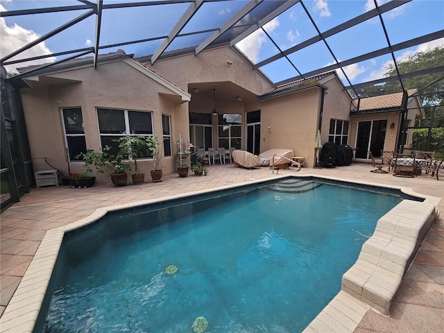 6900 Molakai Cir, Boynton Beach, FL 33437 - swimming pool with a patio area, a ceiling fan, glass enclosure, and outdoor dining area