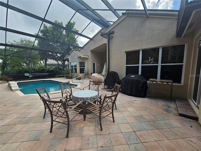 6900 Molakai Cir, Boynton Beach, FL 33437 - outdoor pool featuring grilling area, a patio, and a lanai