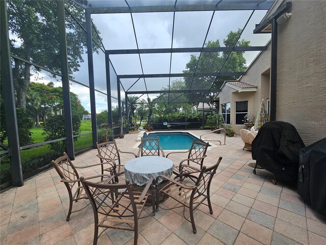 6900 Molakai Cir, Boynton Beach, FL 33437 - outdoor pool with a patio, glass enclosure, and a grill