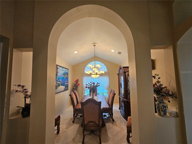 6900 Molakai Cir, Boynton Beach, FL 33437 - dining room featuring arched walkways, lofted ceiling, and a chandelier