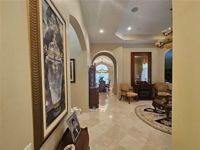 6900 Molakai Cir, Boynton Beach, FL 33437 - entrance foyer with arched walkways, recessed lighting, a chandelier, and light marble finish floors
