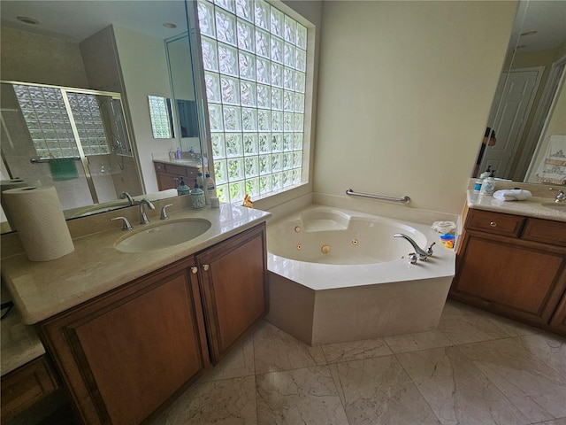 6900 Molakai Cir, Boynton Beach, FL 33437 - bathroom featuring a tub with jets, a stall shower, two vanities, and marble look tiles