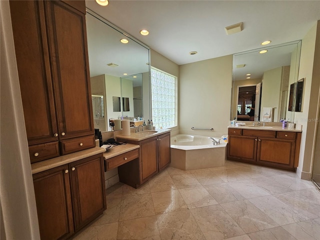 6900 Molakai Cir, Boynton Beach, FL 33437 - bathroom featuring a bath, two vanities, and recessed lighting
