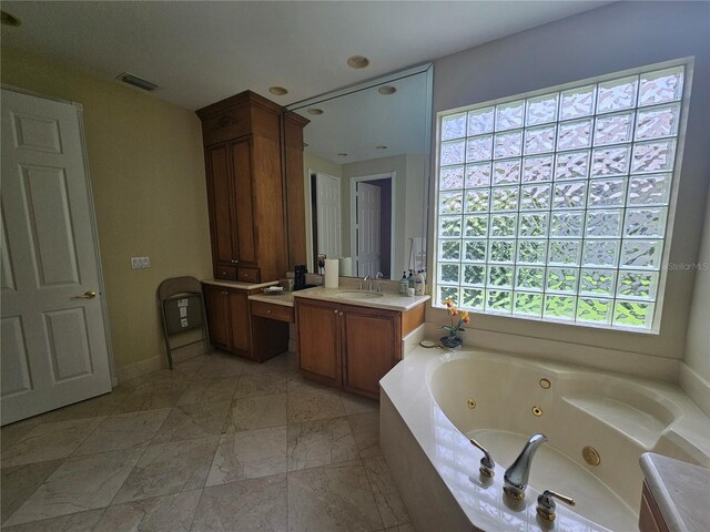 6900 Molakai Cir, Boynton Beach, FL 33437 - bathroom with vanity, a tub with jets, and marble finish flooring