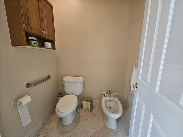 6900 Molakai Cir, Boynton Beach, FL 33437 - bathroom featuring a bidet and marble look tiles