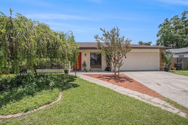 750 Caliente Dr, Brandon, FL 33511 - view of front facade with concrete driveway, an attached garage, stucco siding, and stone siding