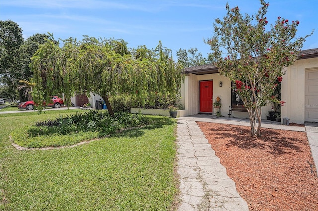 750 Caliente Dr, Brandon, FL 33511 - view of front of house with a front lawn