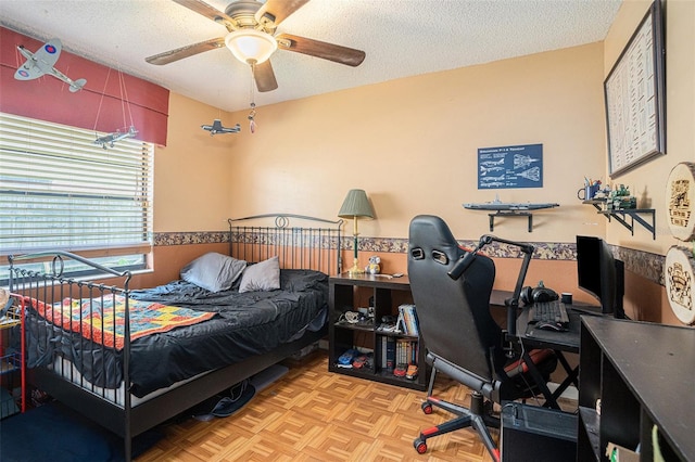 750 Caliente Dr, Brandon, FL 33511 - bedroom with an office area, a textured ceiling, and a ceiling fan