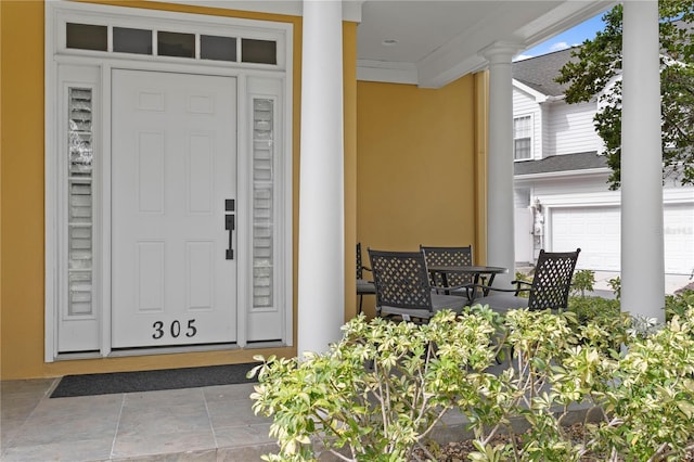 305 Sea Island Way, Tampa, FL 33602 - property entrance featuring stucco siding and a garage