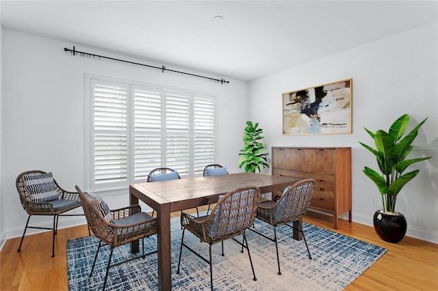 305 Sea Island Way, Tampa, FL 33602 - dining area with light wood-style flooring and baseboards