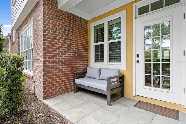 305 Sea Island Way, Tampa, FL 33602 - view of exterior entry with brick siding and a porch