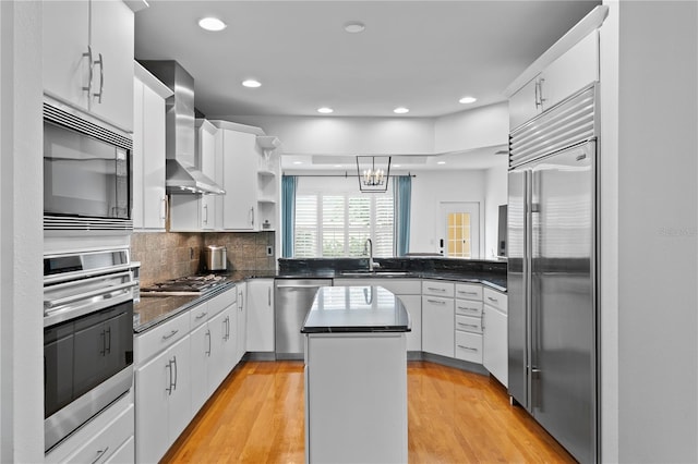 305 Sea Island Way, Tampa, FL 33602 - kitchen with built in appliances, wall chimney exhaust hood, a kitchen island, open shelves, and white cabinets