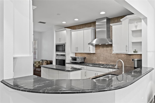 305 Sea Island Way, Tampa, FL 33602 - kitchen featuring wall chimney exhaust hood, open shelves, stainless steel appliances, decorative backsplash, and a peninsula