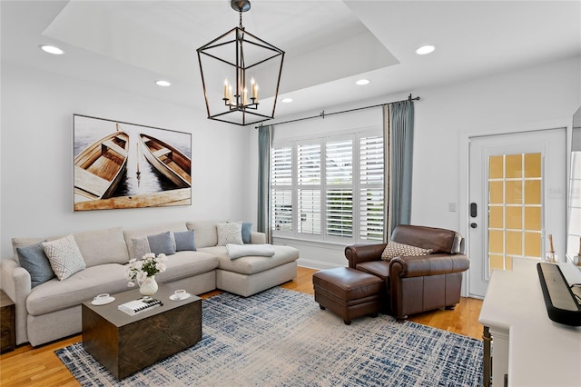 305 Sea Island Way, Tampa, FL 33602 - living room featuring recessed lighting, light wood-type flooring, and a chandelier