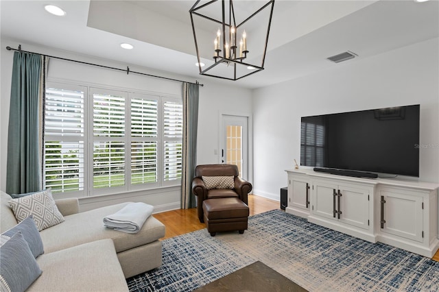 305 Sea Island Way, Tampa, FL 33602 - living room featuring recessed lighting, a chandelier, and light wood-style floors