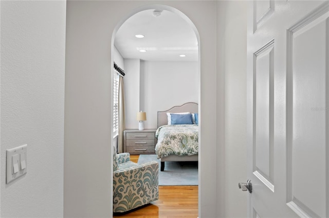 305 Sea Island Way, Tampa, FL 33602 - bedroom with arched walkways and wood finished floors