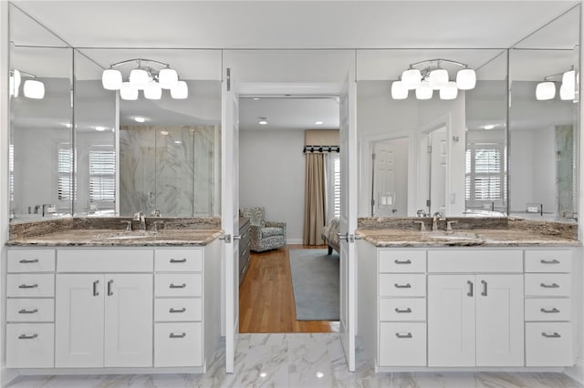 305 Sea Island Way, Tampa, FL 33602 - bathroom featuring ensuite bath, a marble finish shower, two vanities, and marble look tile flooring