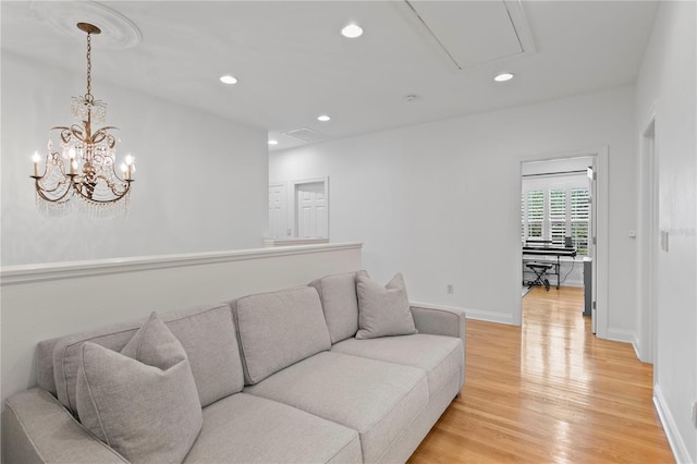 305 Sea Island Way, Tampa, FL 33602 - living room featuring attic access, light wood finished floors, and recessed lighting