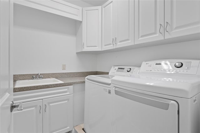 305 Sea Island Way, Tampa, FL 33602 - laundry room featuring cabinet space and washing machine and dryer