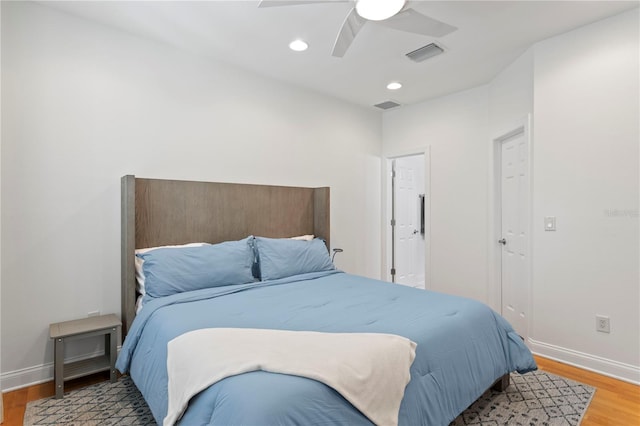 305 Sea Island Way, Tampa, FL 33602 - bedroom with light wood-style flooring, a ceiling fan, and recessed lighting
