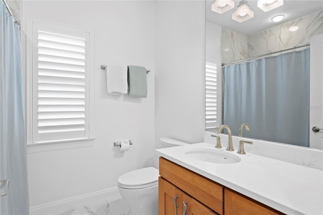 305 Sea Island Way, Tampa, FL 33602 - bathroom featuring vanity, marble finish floors, plenty of natural light, and curtained shower
