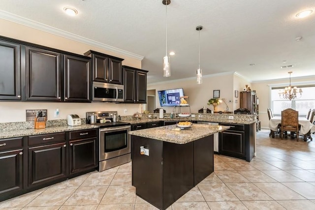 2639 Yukon Cliff Dr, Ruskin, FL 33570 - kitchen featuring appliances with stainless steel finishes, a peninsula, a center island, light tile patterned floors, and crown molding