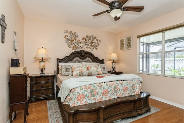2639 Yukon Cliff Dr, Ruskin, FL 33570 - bedroom featuring wood finished floors and ceiling fan