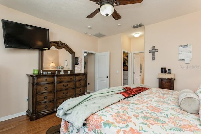2639 Yukon Cliff Dr, Ruskin, FL 33570 - bedroom featuring wood finished floors and a ceiling fan
