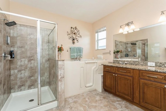 2639 Yukon Cliff Dr, Ruskin, FL 33570 - full bath featuring a shower stall, a bath, and vanity