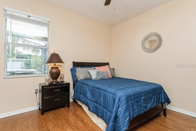 2639 Yukon Cliff Dr, Ruskin, FL 33570 - bedroom featuring wood finished floors and a ceiling fan