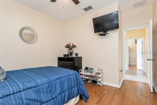 2639 Yukon Cliff Dr, Ruskin, FL 33570 - bedroom featuring wood finished floors and ceiling fan