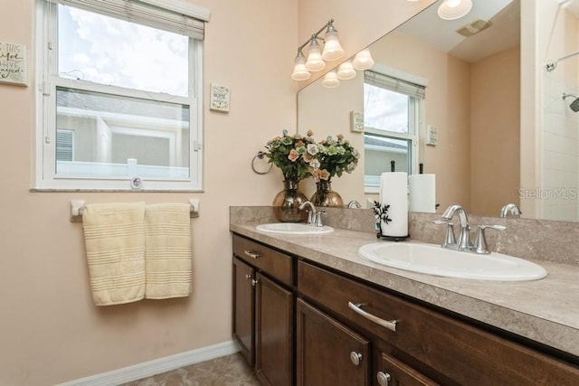 2639 Yukon Cliff Dr, Ruskin, FL 33570 - bathroom with double vanity and baseboards
