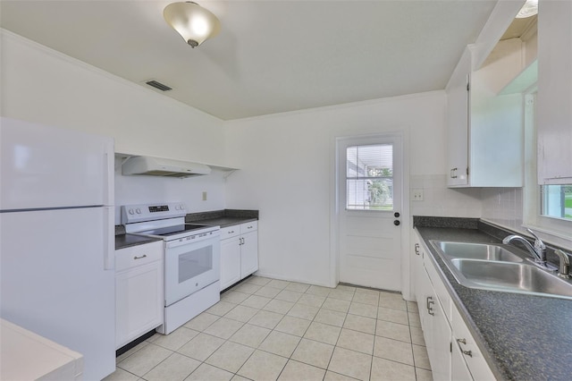 106 W N Branch Rd, Ruskin, FL 33570 - kitchen with white appliances, range hood, dark countertops, white cabinetry, and light tile patterned floors