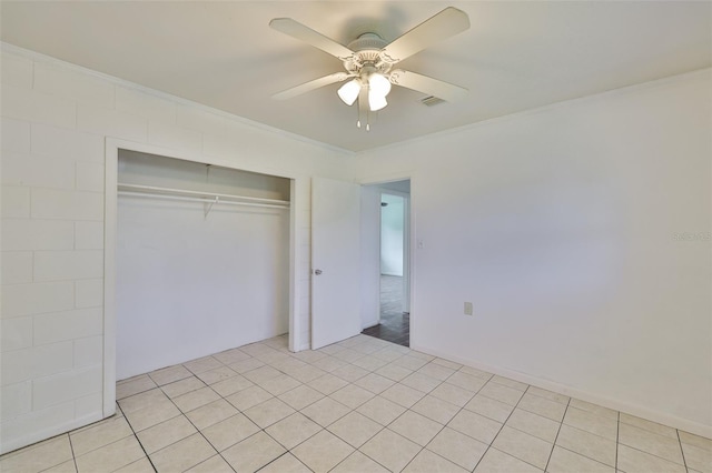 106 W N Branch Rd, Ruskin, FL 33570 - unfurnished bedroom with ornamental molding, a closet, ceiling fan, and light tile patterned floors
