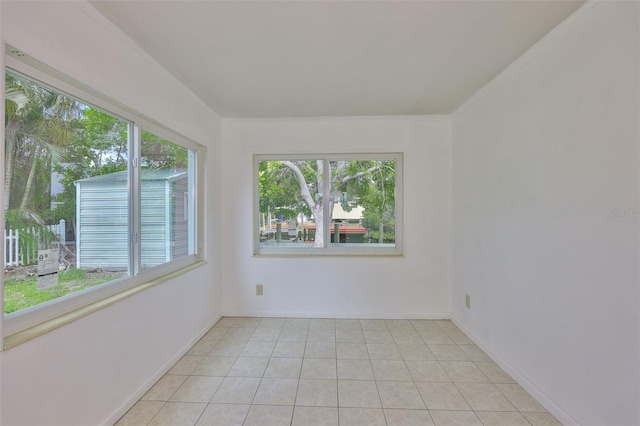 106 W N Branch Rd, Ruskin, FL 33570 - spare room with light tile patterned floors and baseboards