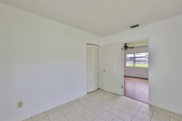 106 W N Branch Rd, Ruskin, FL 33570 - empty room featuring light tile patterned flooring, ornamental molding, and ceiling fan