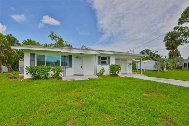 106 W N Branch Rd, Ruskin, FL 33570 - ranch-style house featuring an attached garage, driveway, and a front lawn