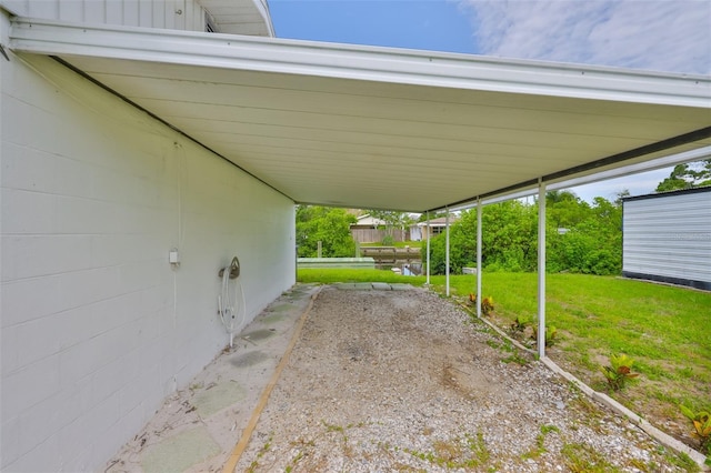 106 W N Branch Rd, Ruskin, FL 33570 - view of grassy yard featuring an attached carport
