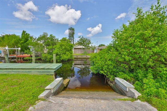 106 W N Branch Rd, Ruskin, FL 33570 - view of property's community with a boat ramp, a water view, and a dock
