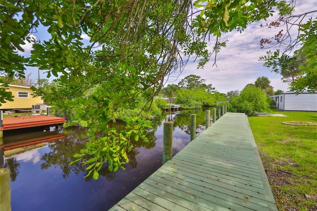 106 W N Branch Rd, Ruskin, FL 33570 - dock area with a water view and a yard
