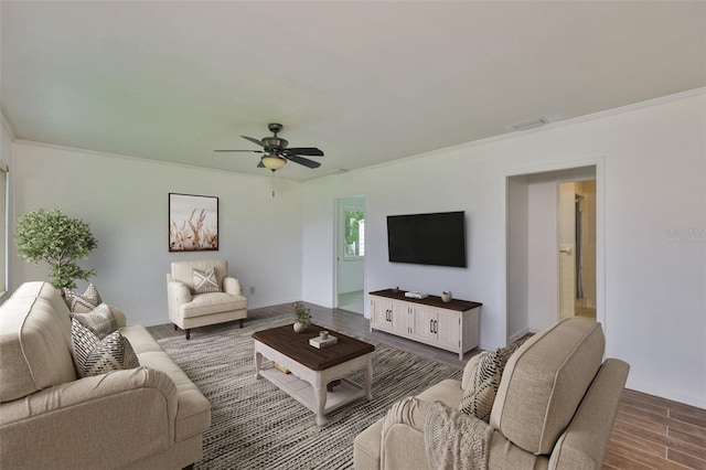 106 W N Branch Rd, Ruskin, FL 33570 - living room with dark wood finished floors, crown molding, and a ceiling fan