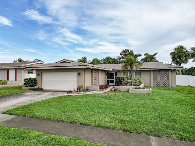 14424 Neptune Rd, Seminole, FL 33776 - ranch-style home with a garage, stucco siding, a tiled roof, and driveway